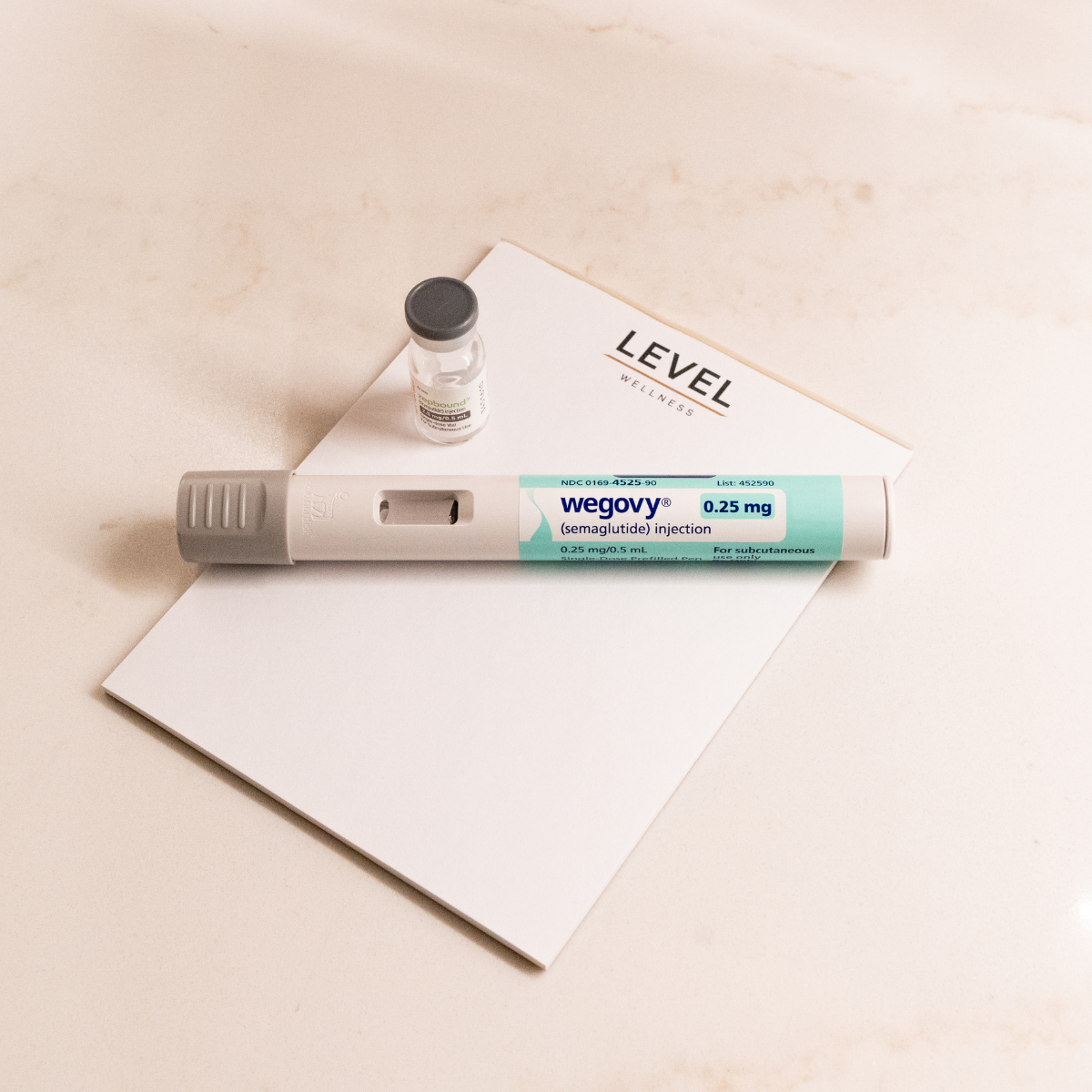 Wegovy GLP-1 Pen on top of Level notepad